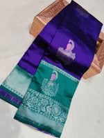 Purple and green saree with peacock design on a white background