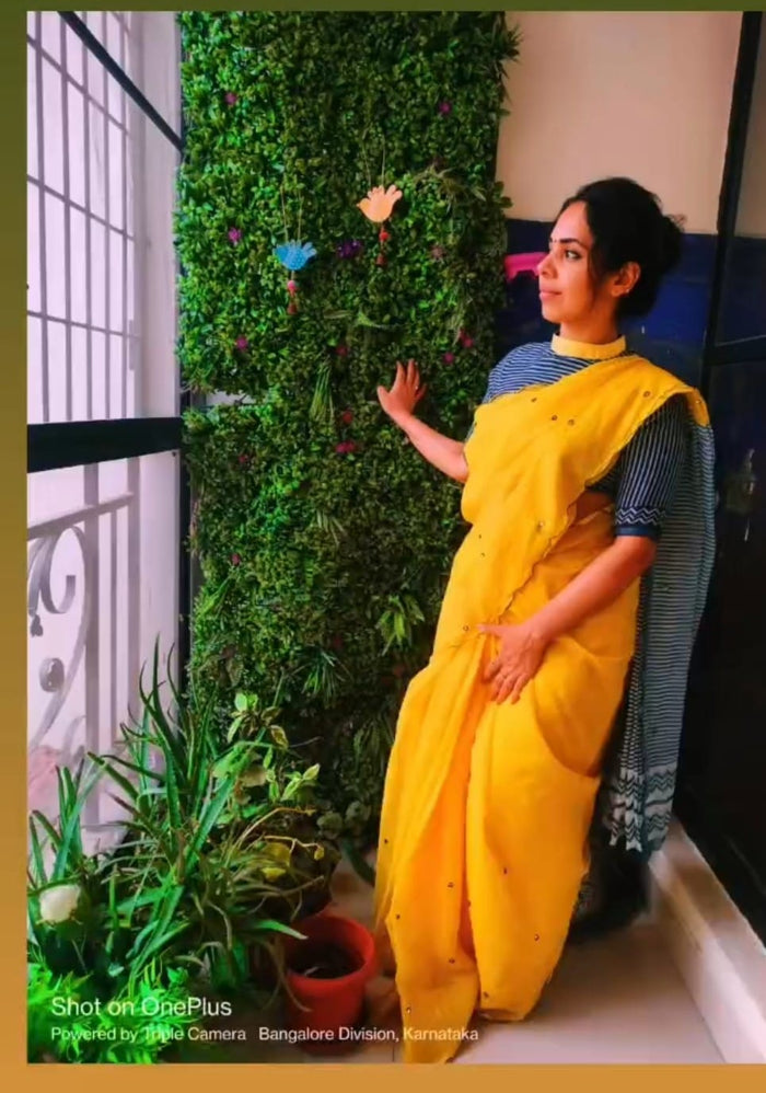 Customer wearing Fancy Cotton Saree with Kalamkari Blouse — Yellow
