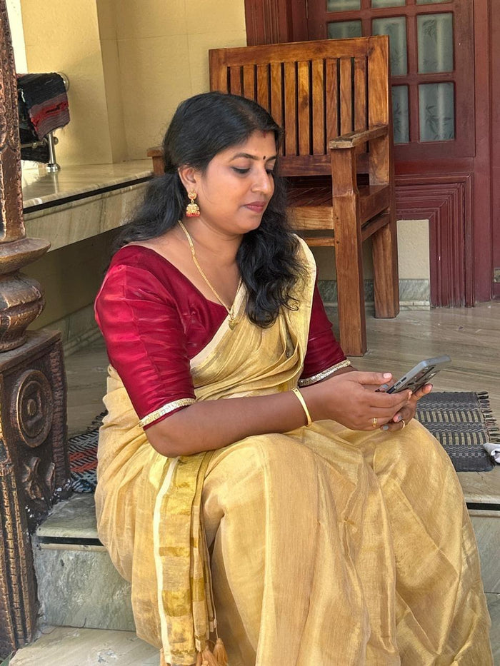 Customer wearing wide border kerala saree